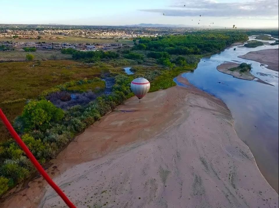 Aerial view of the Rio Grande, sandy riverbanks, and Bosque trees
